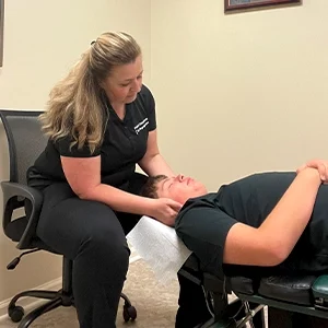 Chiropractor Frankfort KY Athanasia Angelopoulos Adjusting Patient